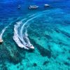 top-view-from-drone-seascape-with-motorboat-in-bay-.jpg